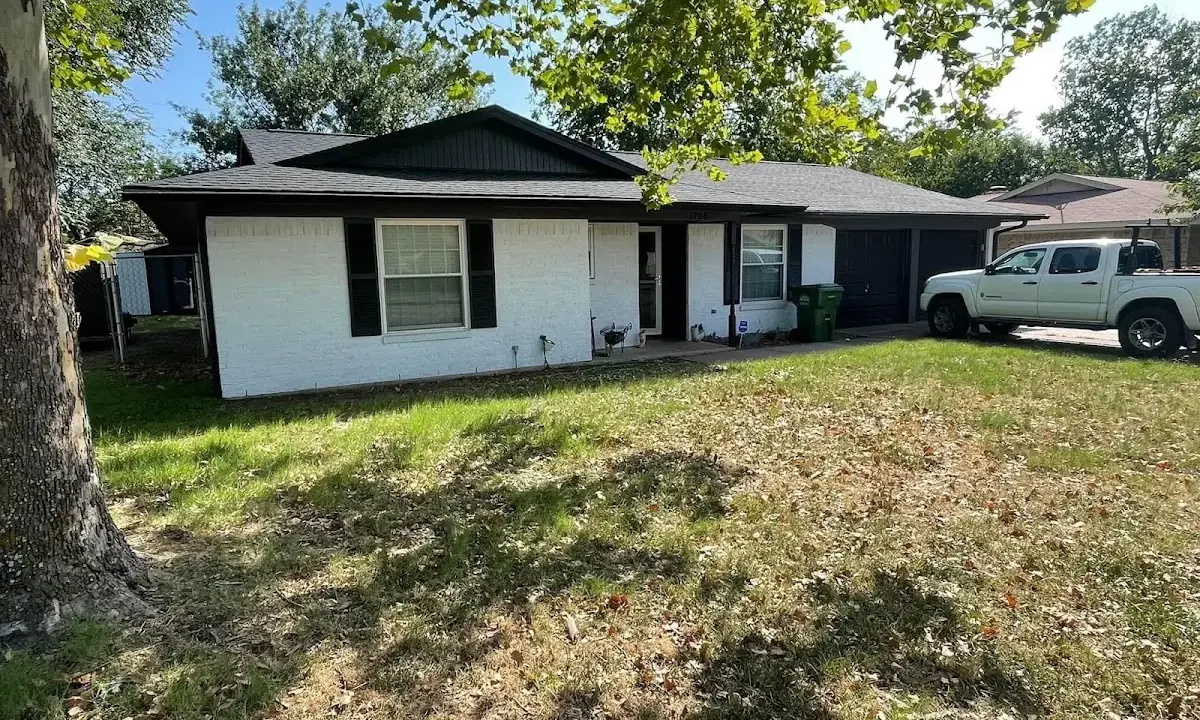 Professional roofing crew working on a residential roof in Lake Goodwin